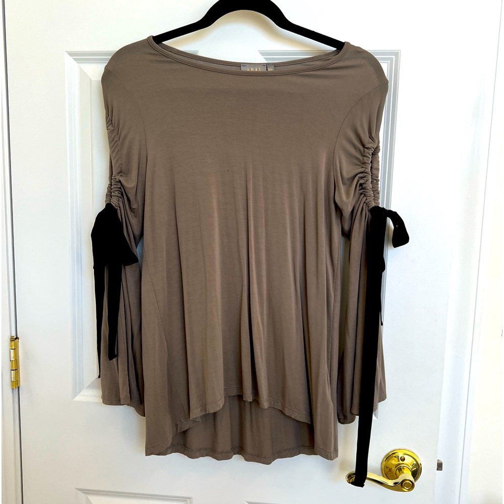 This cute and comfy top can be dressed up or down with jeans or leggings.